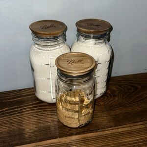 Set of three glass jars with air tight lids.
